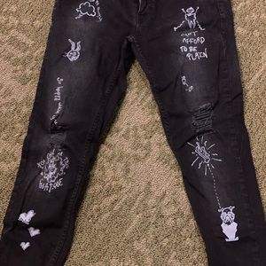 Black illustrated jeans